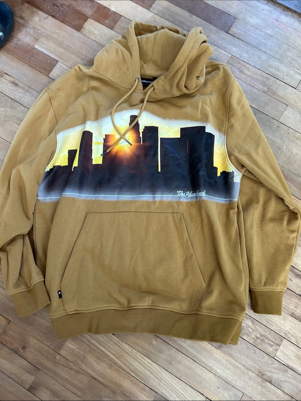 The Hundreds Men's Mustard Hoodie with Black Skyline Graphic